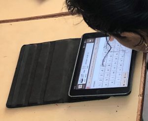 Child with AAC app