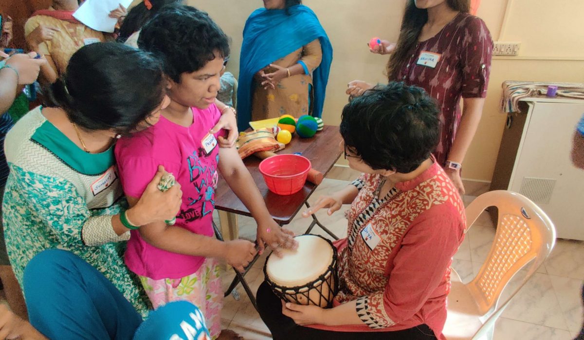 Child playing with Djembe