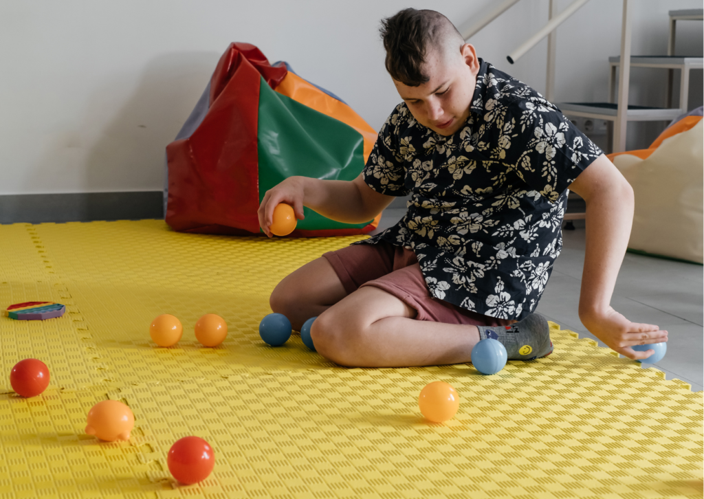 boy in sensory play to learn aac