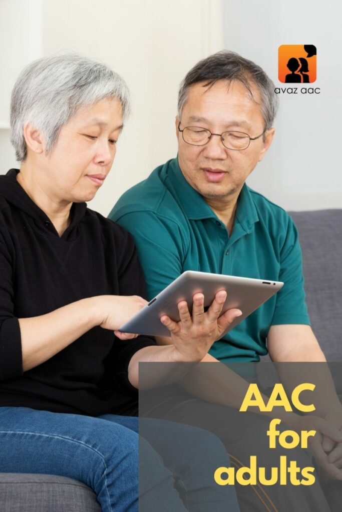 two adults communicating with aac
