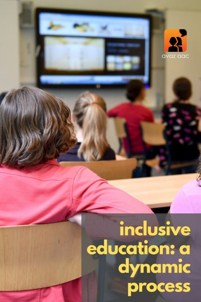 children listening to teacher in an inclusive classroom