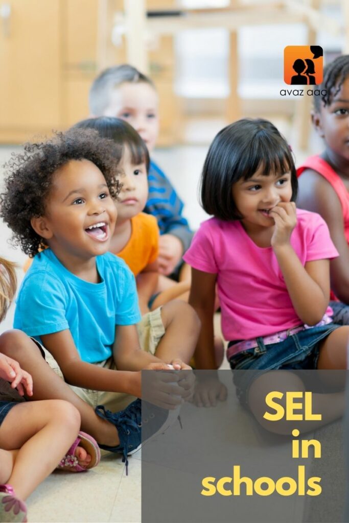 children smiling in a classroom