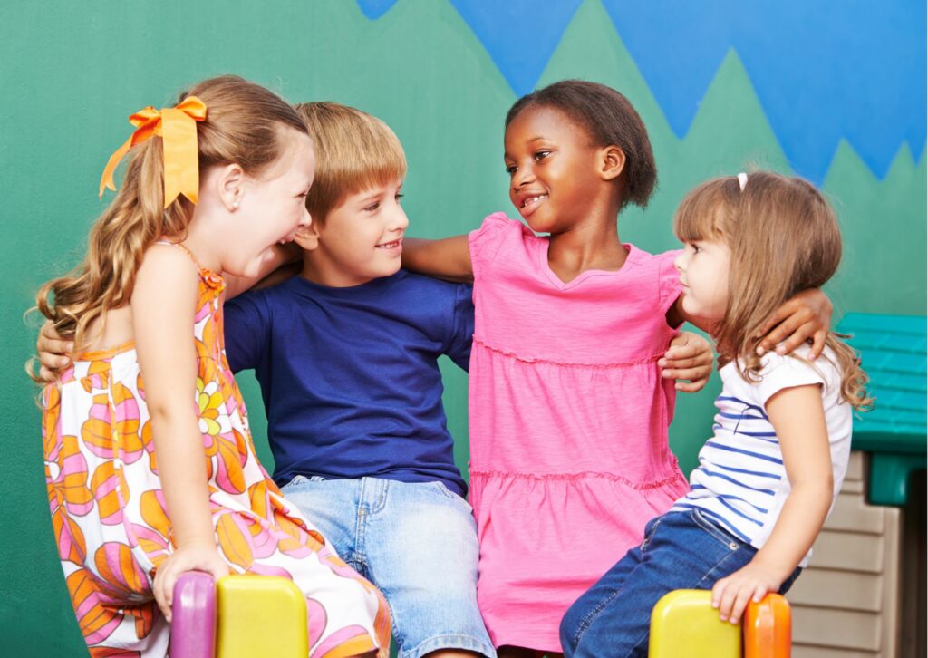 children hugging a child to make him feel included